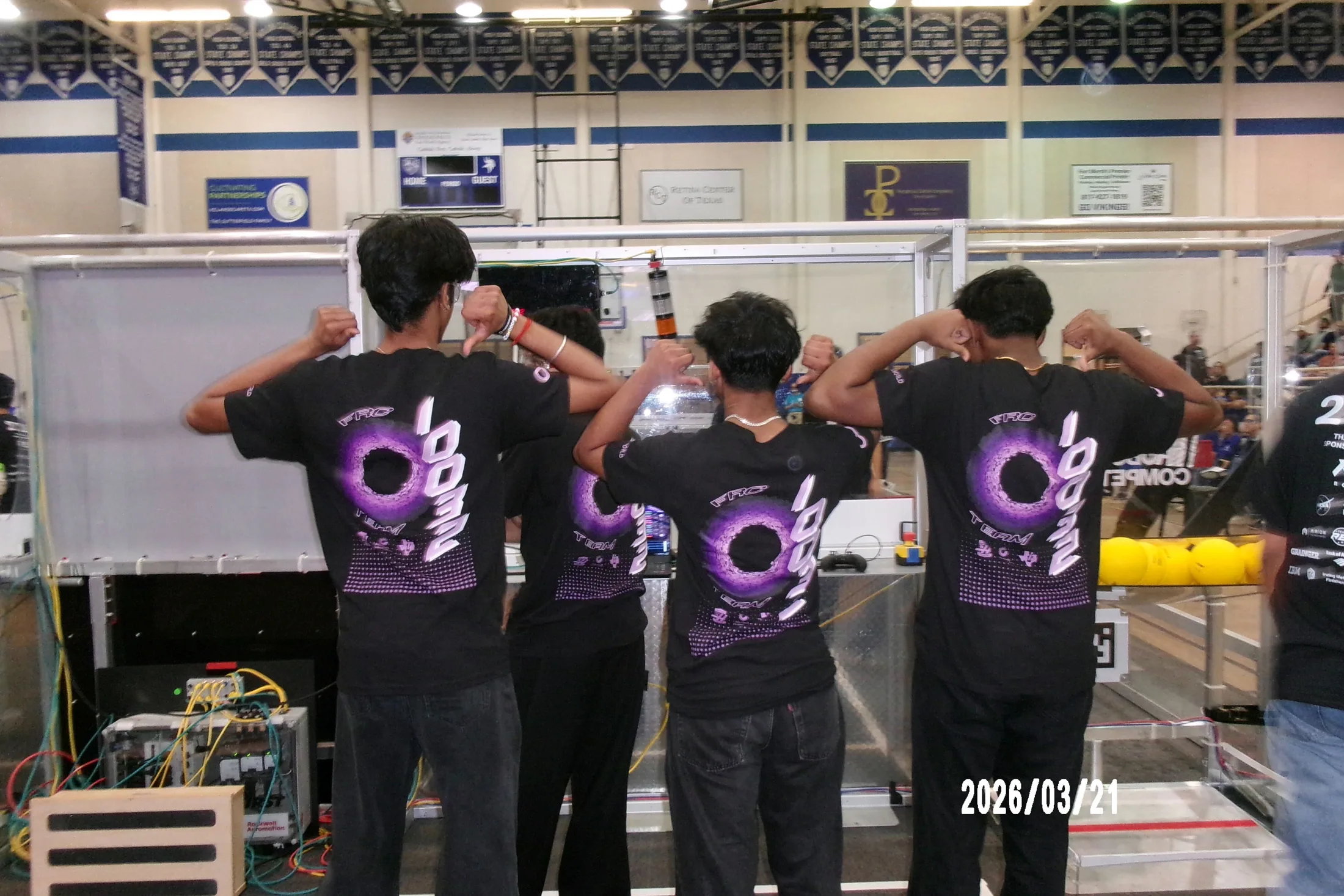 Members watching a match from the pit