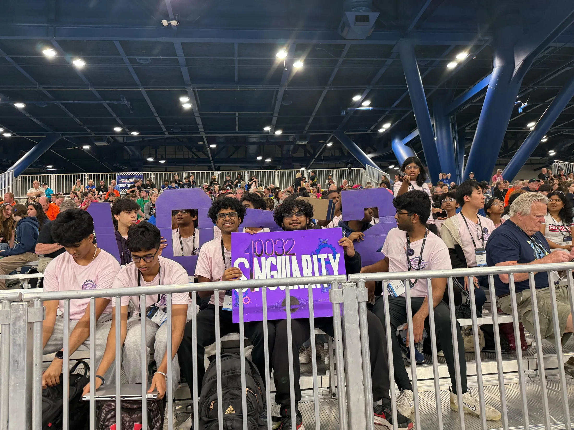 The team at the rail with the Singularity flag