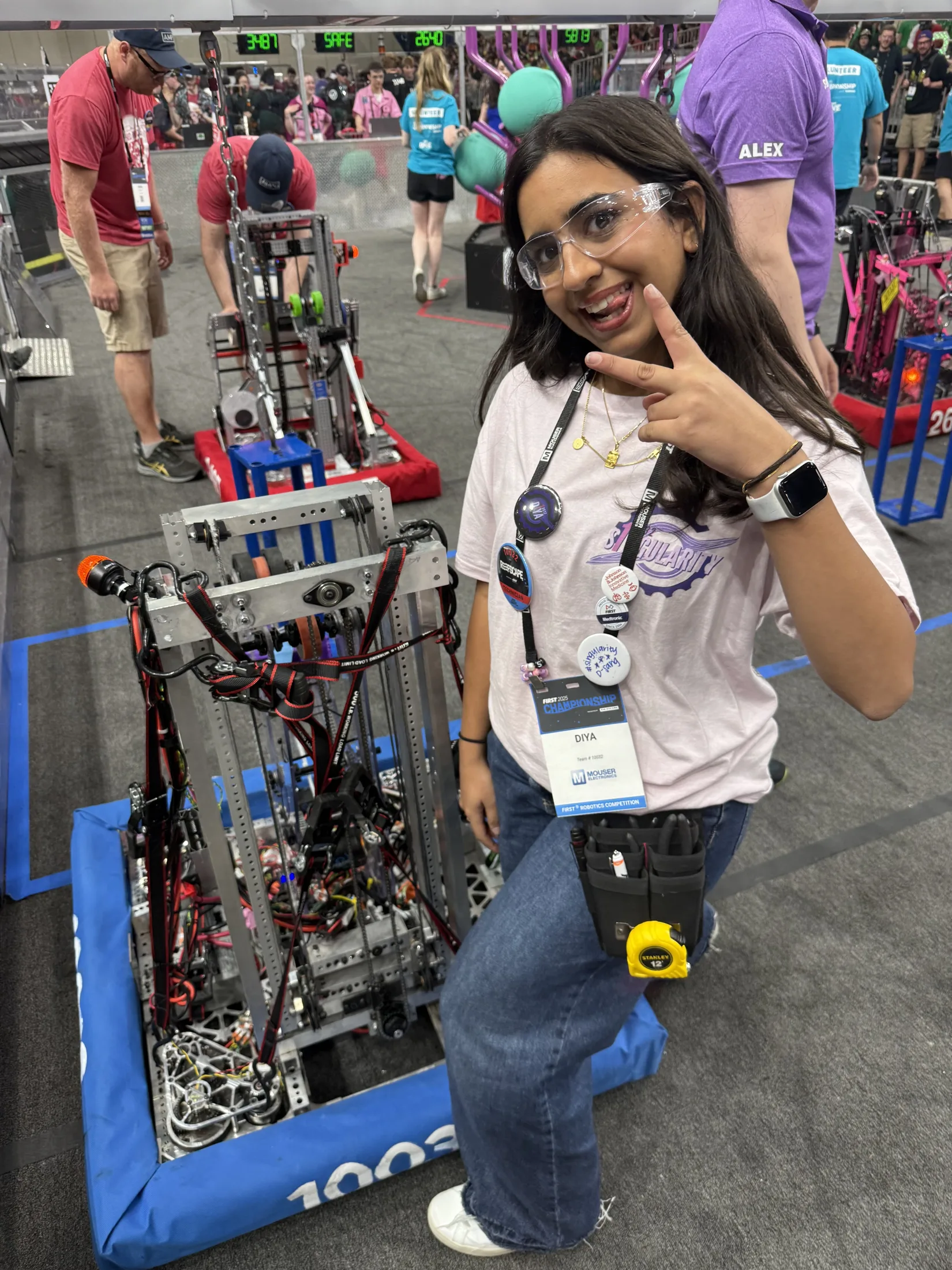 A member with the 2025 robot in the Houston pits