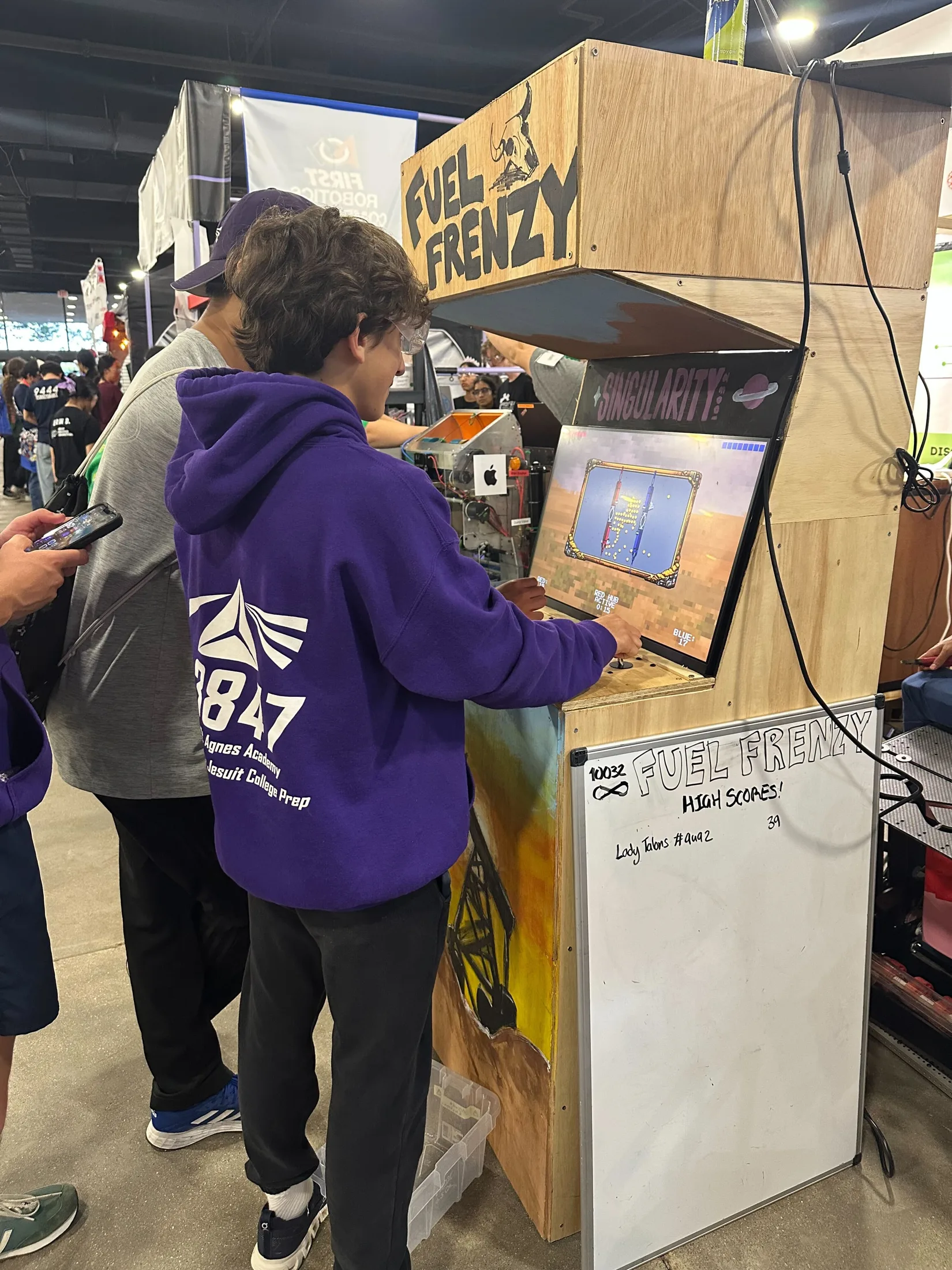 A visitor from another team at the Fuel Frenzy cabinet