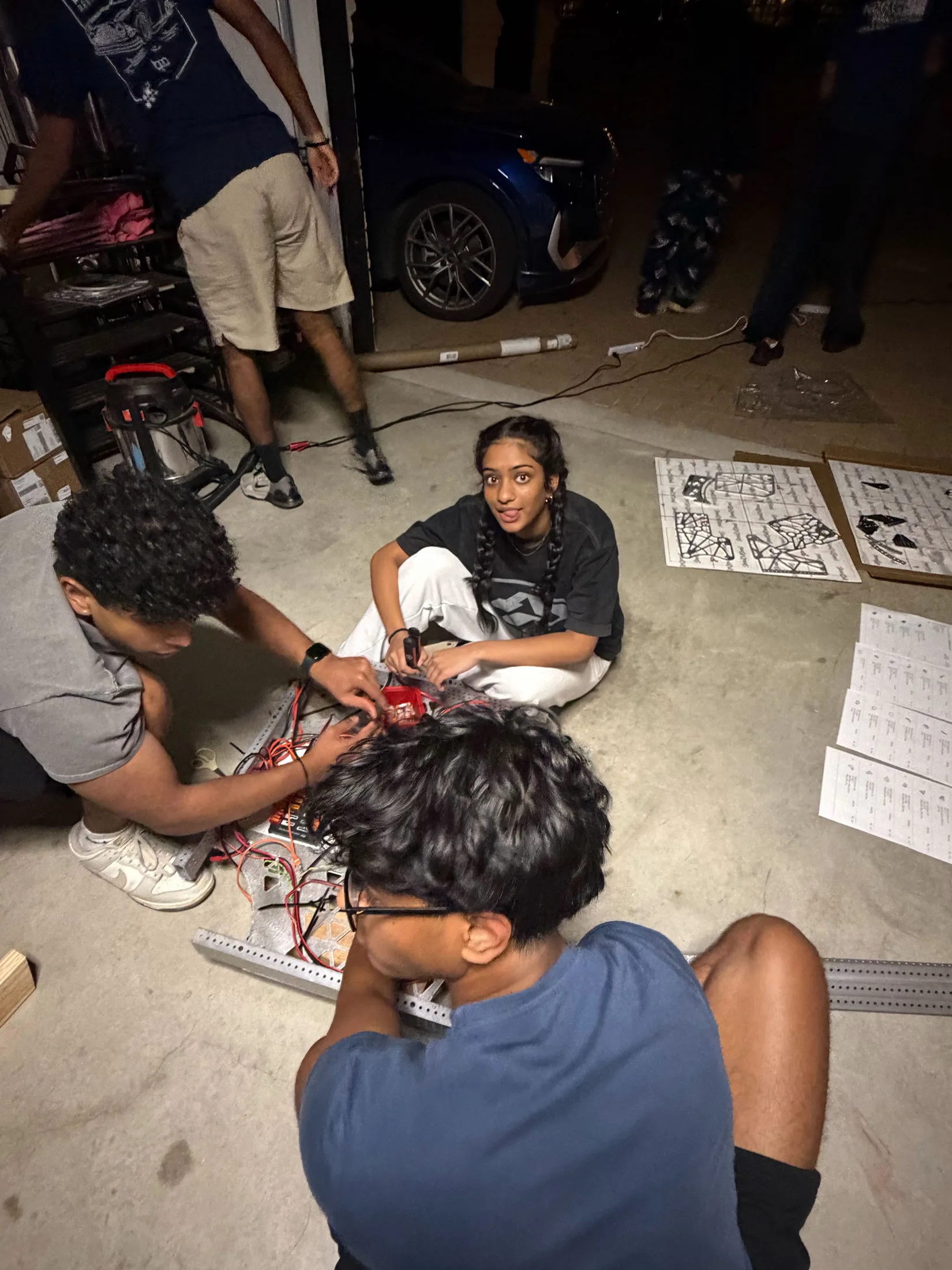 Build night: wiring on the garage floor