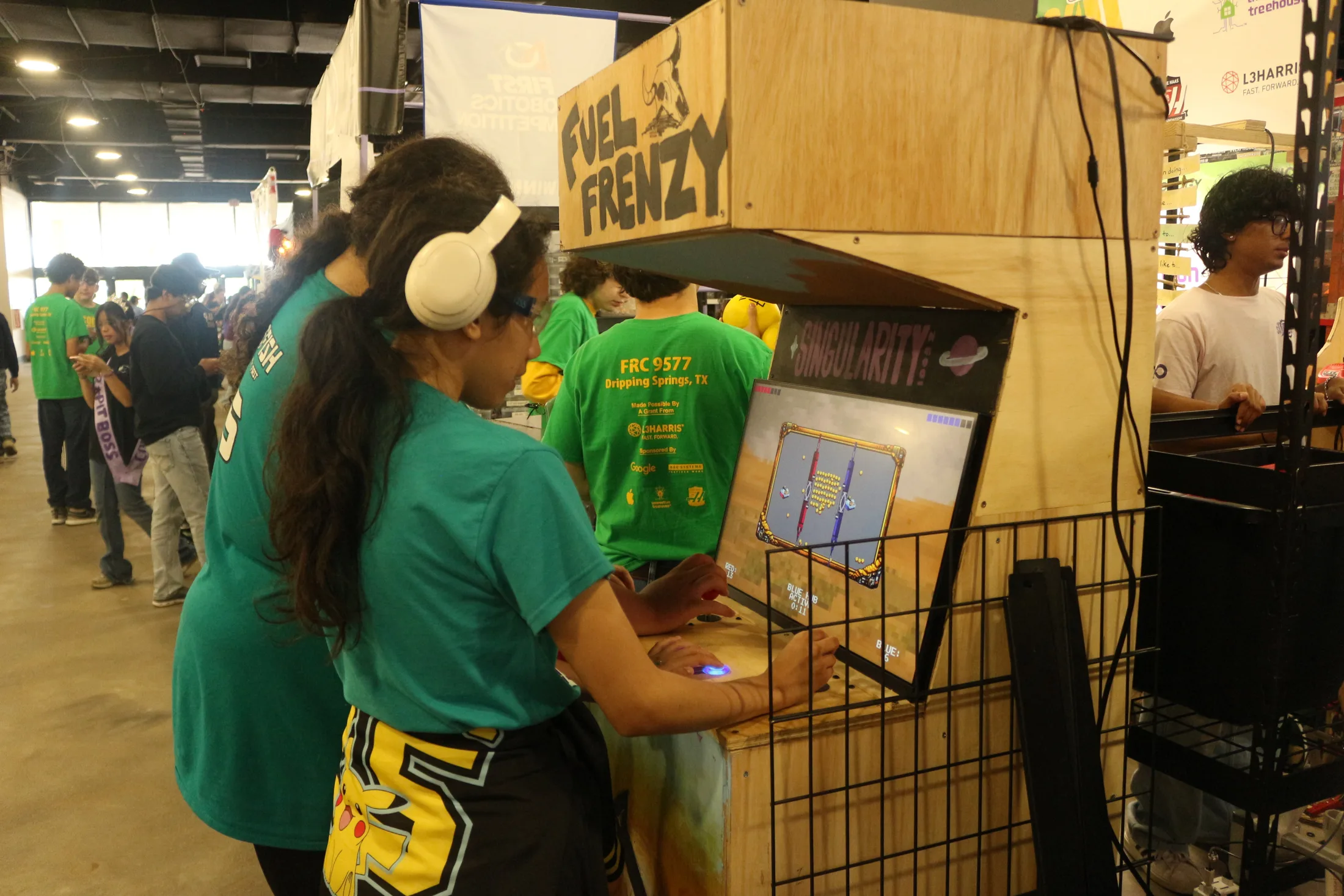 Two players at the Fuel Frenzy cabinet