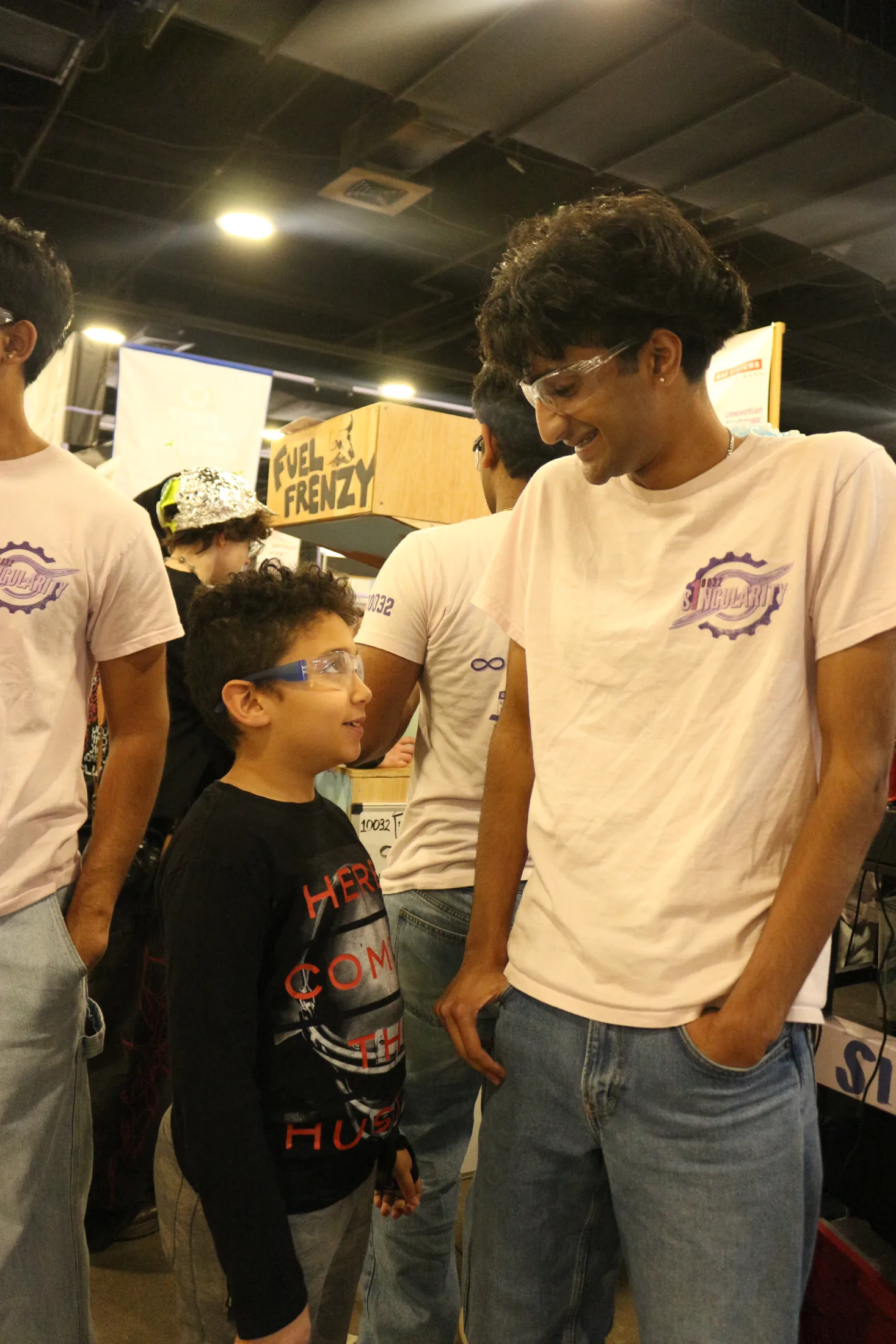 Talking with a young visitor at the pit