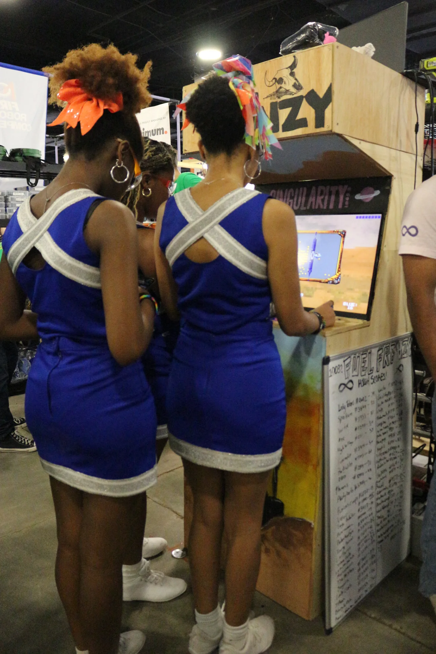 Cheerleaders playing Fuel Frenzy