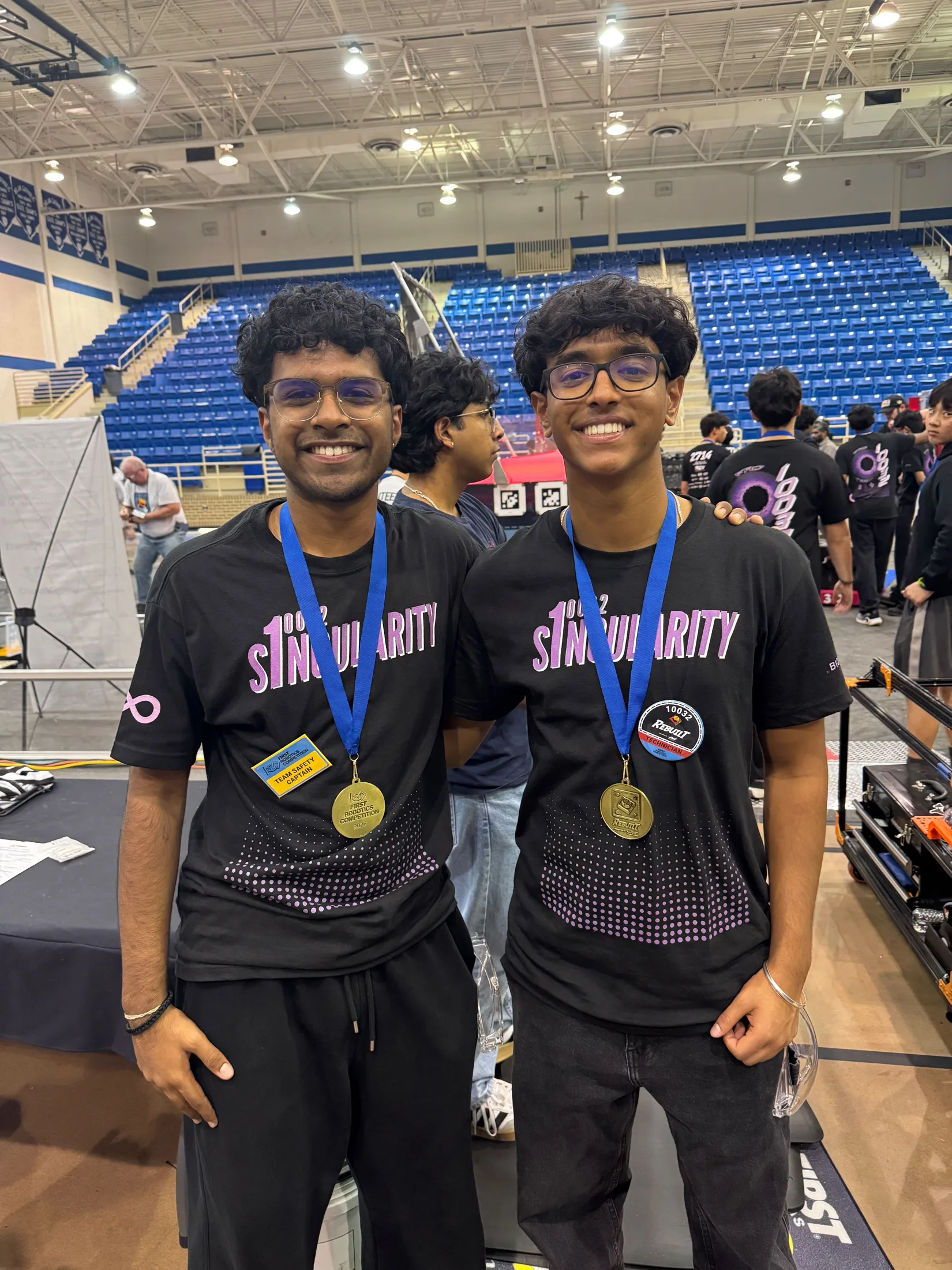 Two members with medals after the win