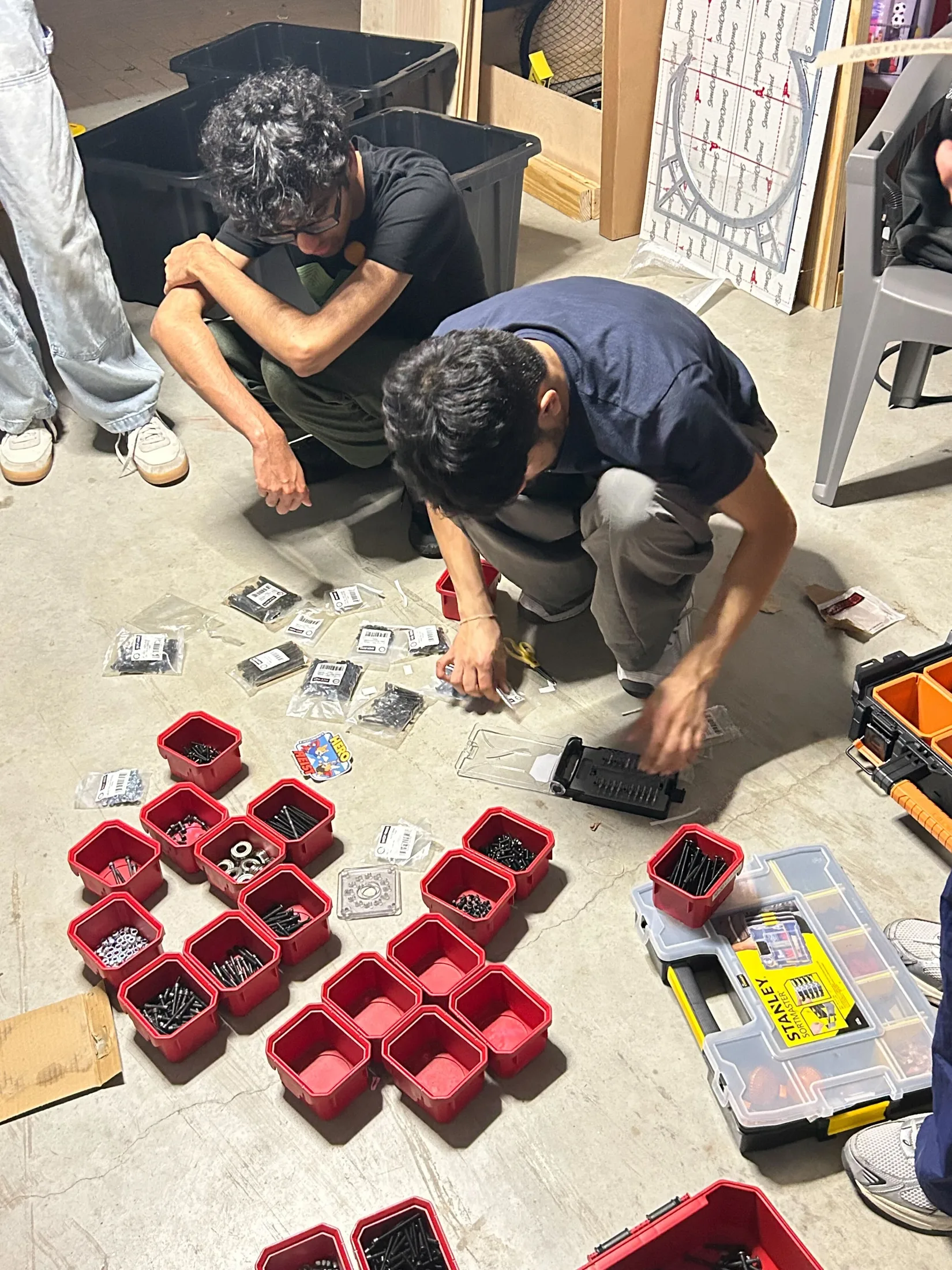 Sorting parts on the garage floor