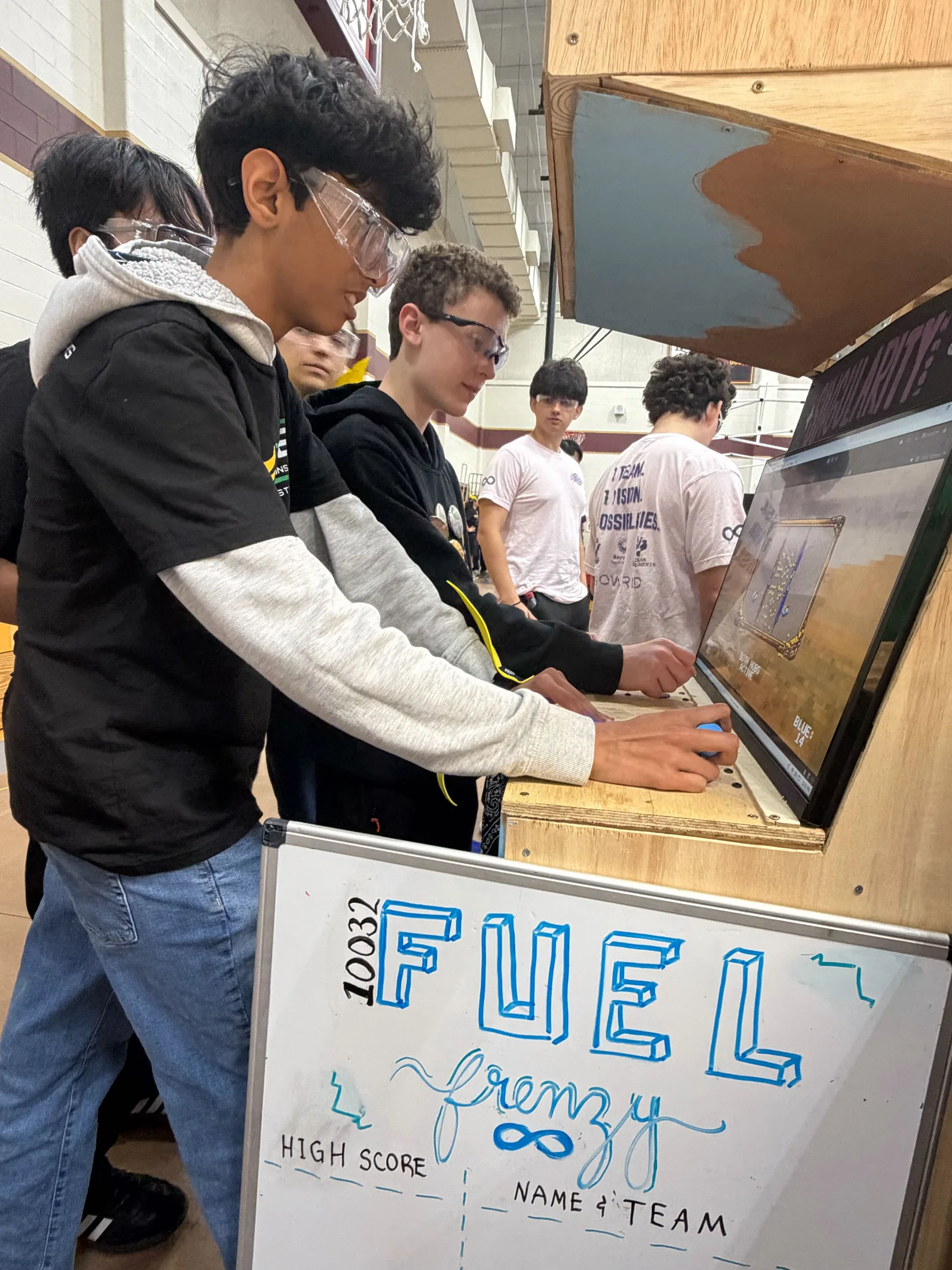 Kids playing the Fuel Frenzy cabinet