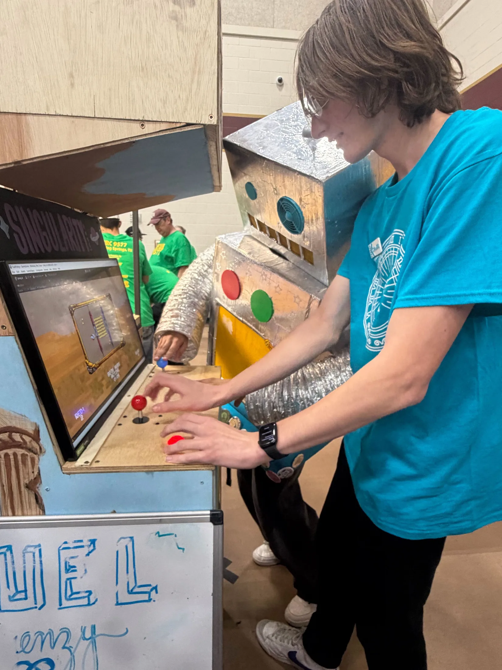 A student at the arcade cabinet