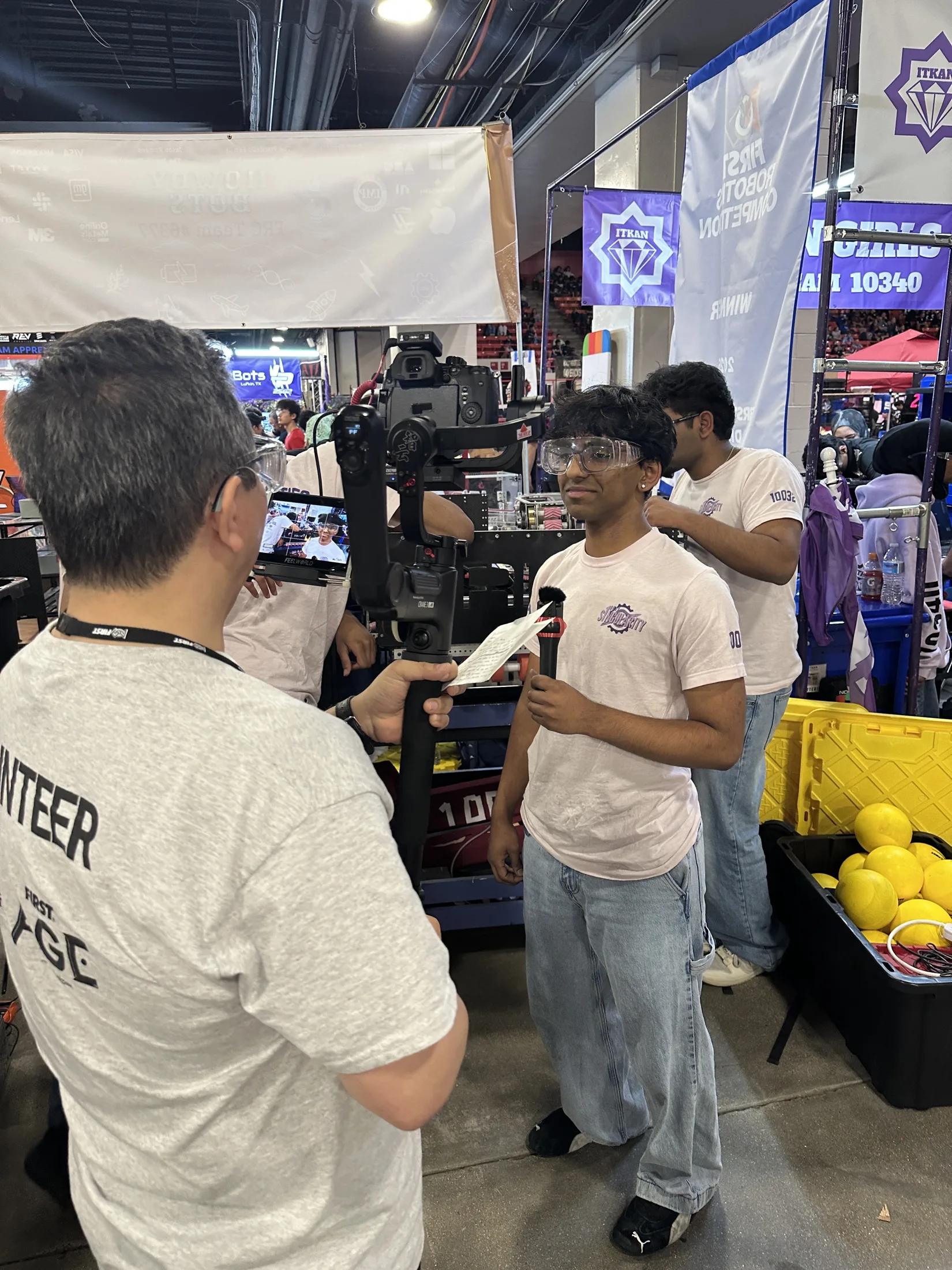A student being interviewed on camera at competition