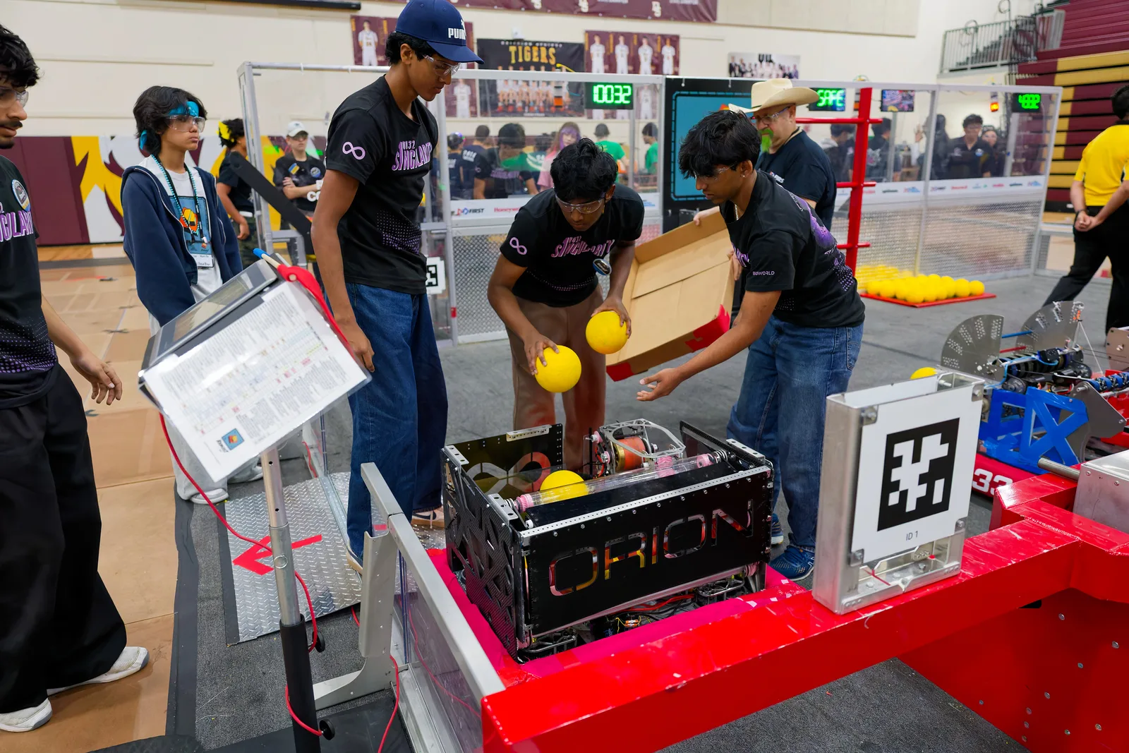 Students working on the robot at a field station