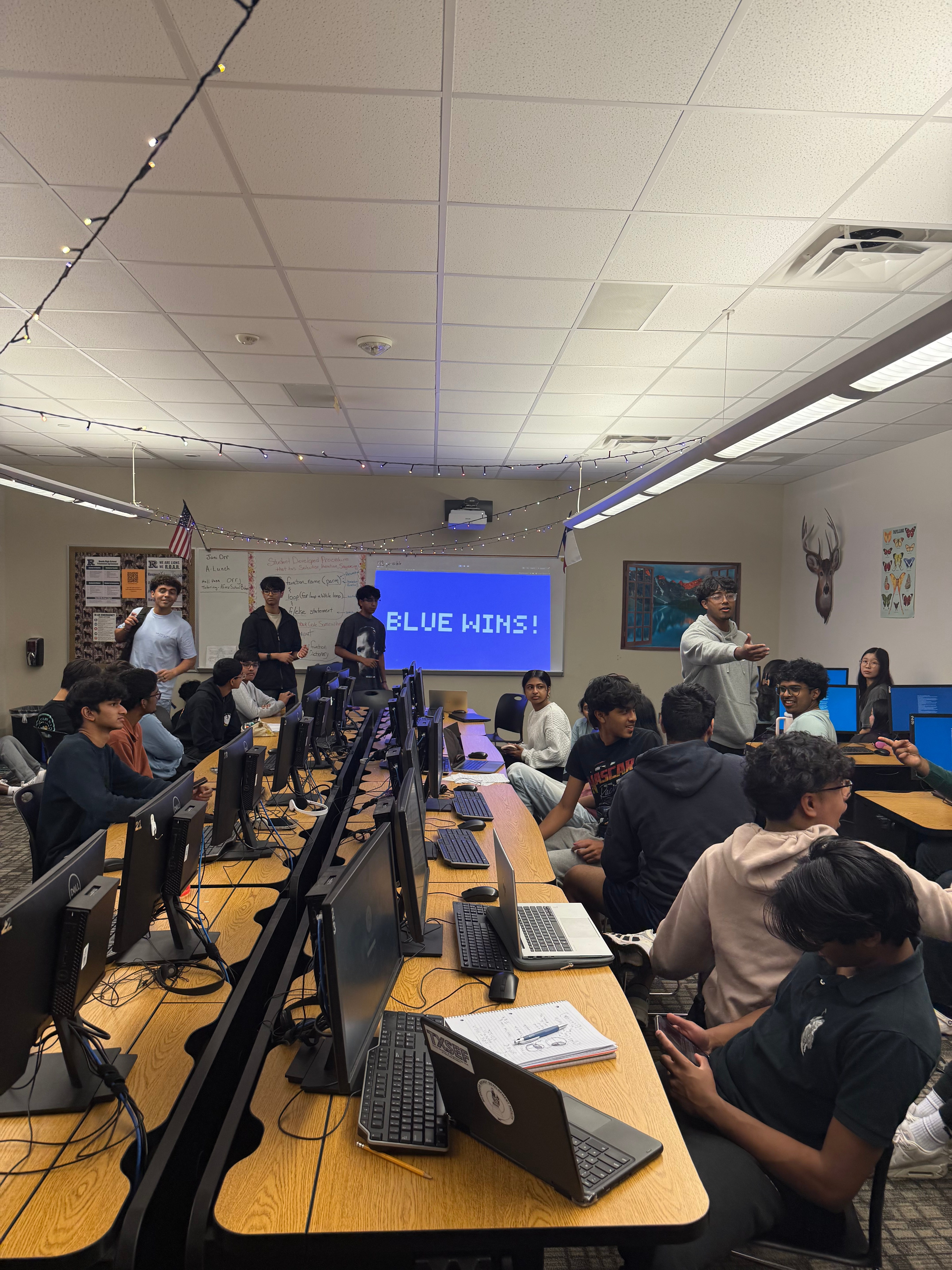 Students playing Algae Abyss during a tournament with Blue Wins screen