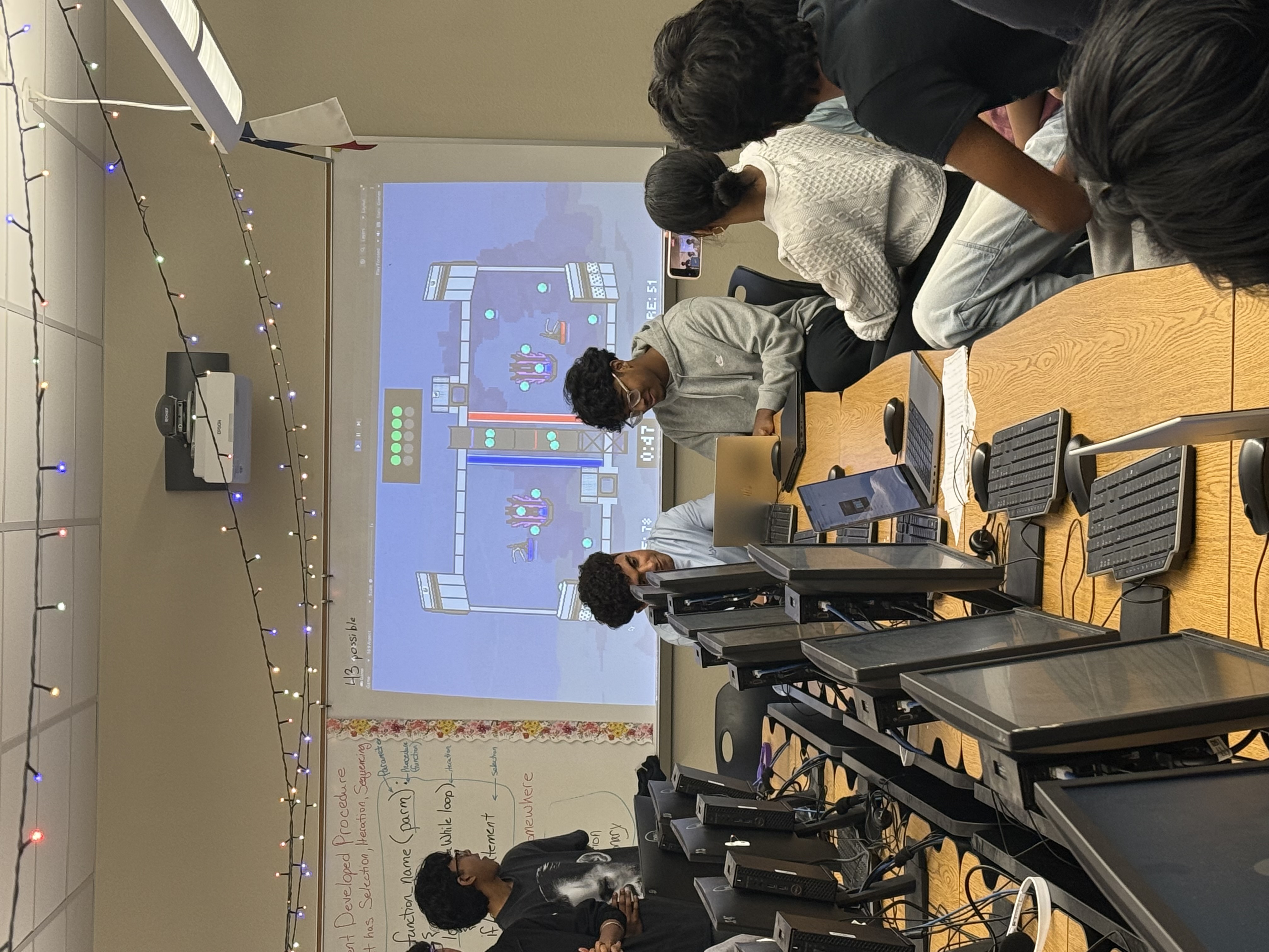 Students engaged in Algae Abyss gameplay during a tournament