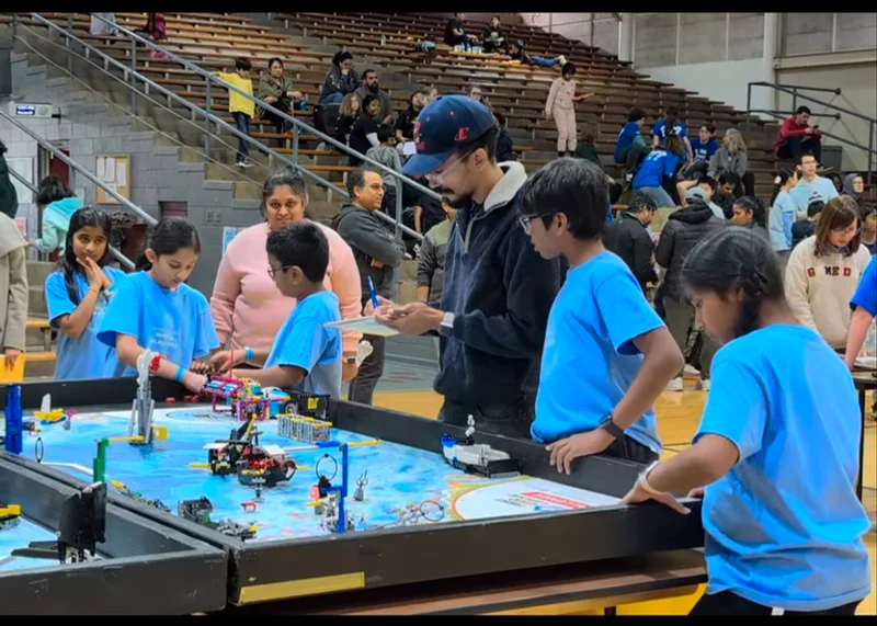 Mentoring an FLL team at the competition table