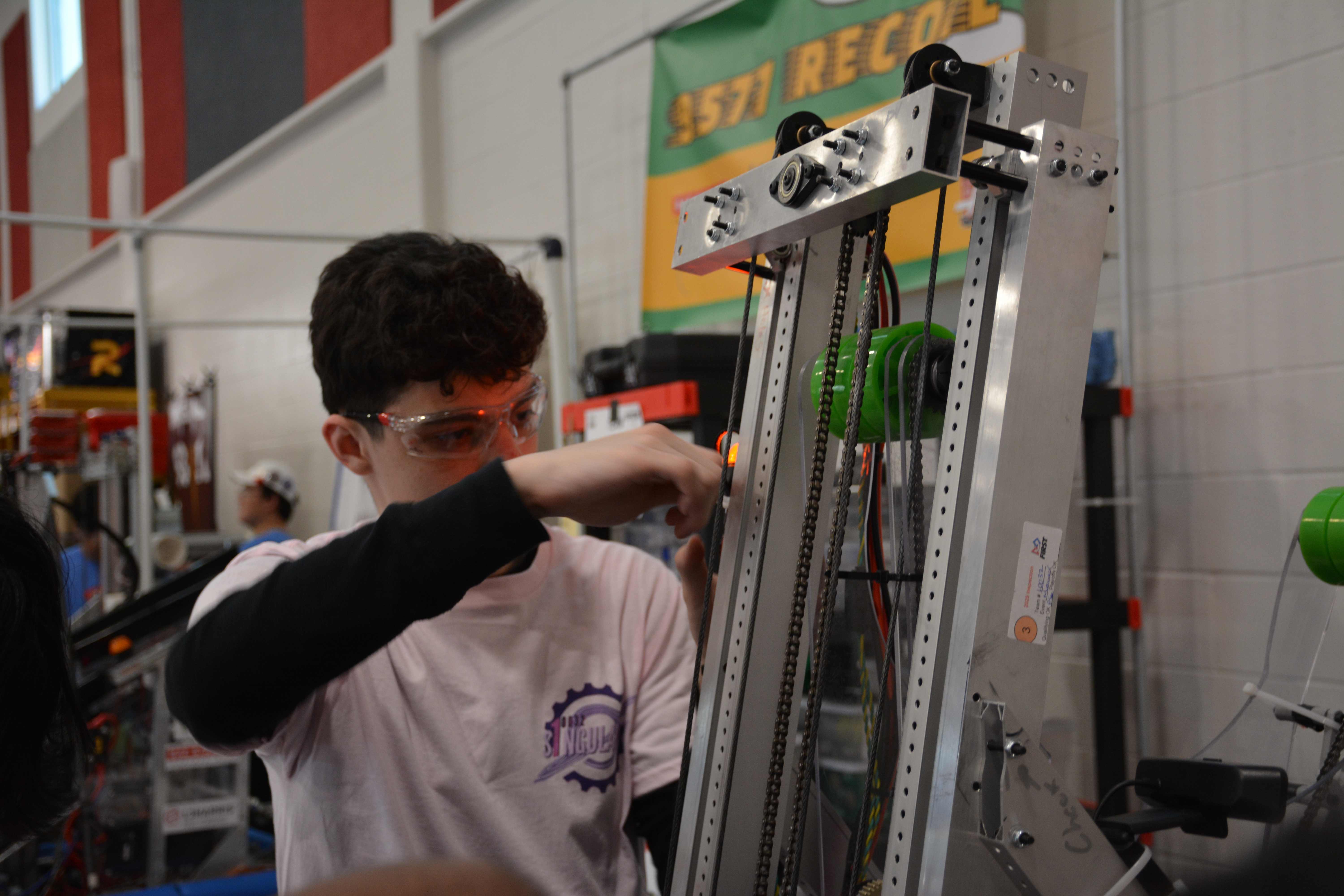 Student working on robot mechanism